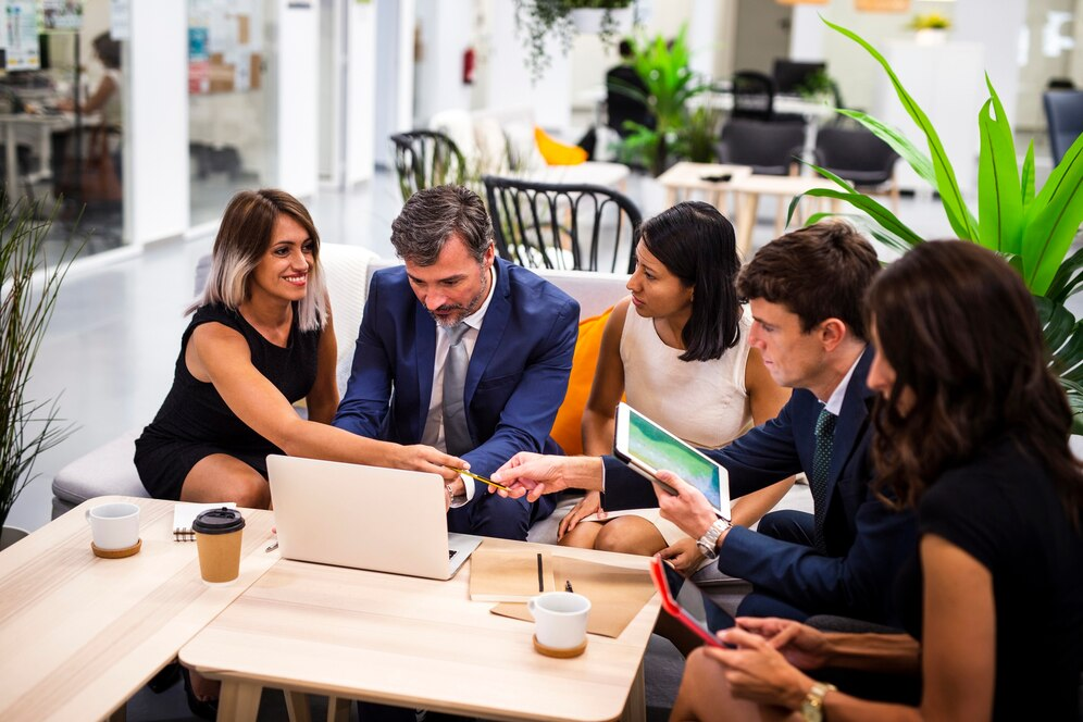 Group of professionals working together in a coffee or coworking space