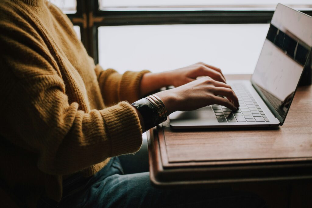 Image of person typing on a computer